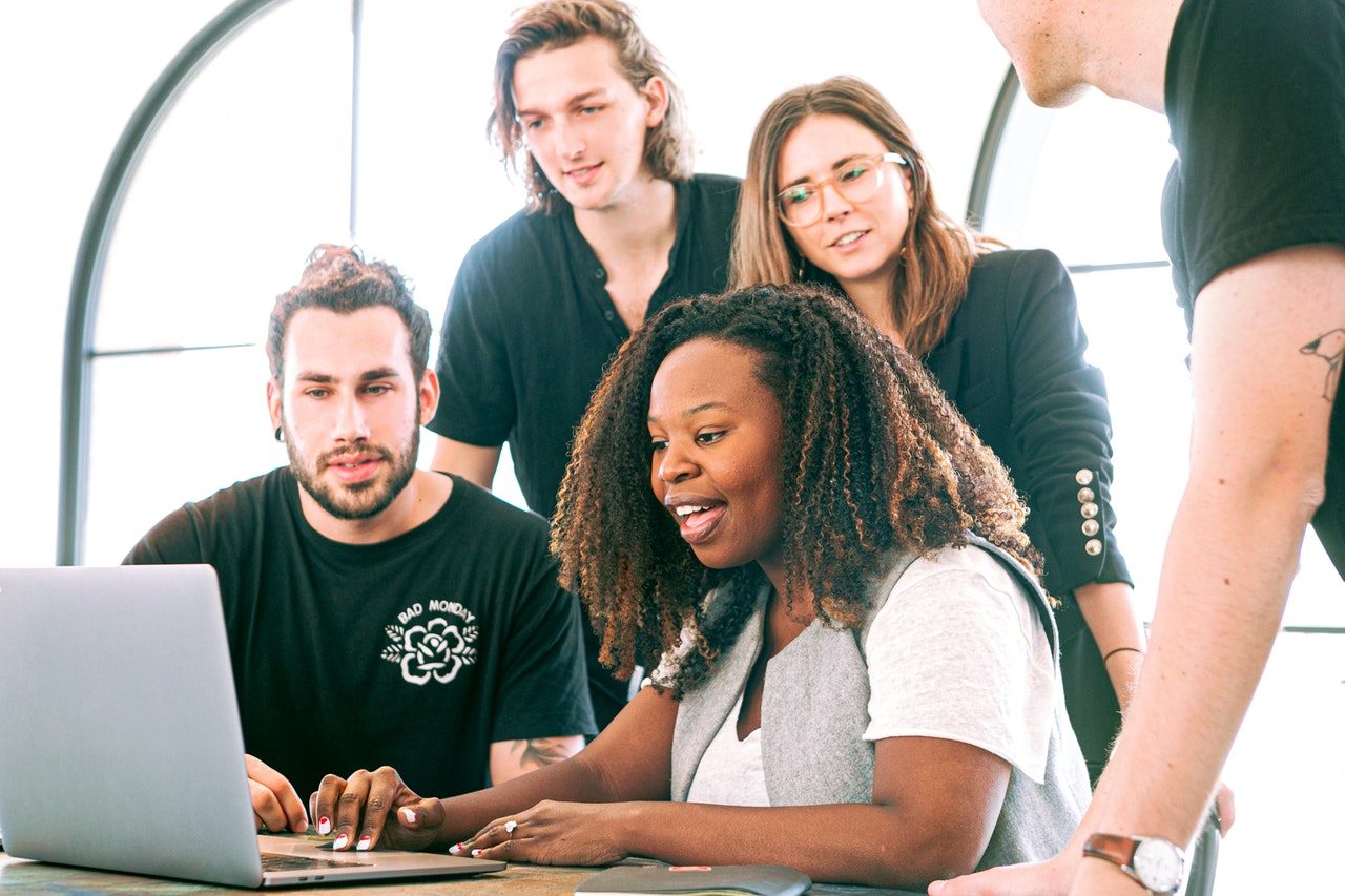 woman-sharing-her-presentation-with-her-colleagues-3153198